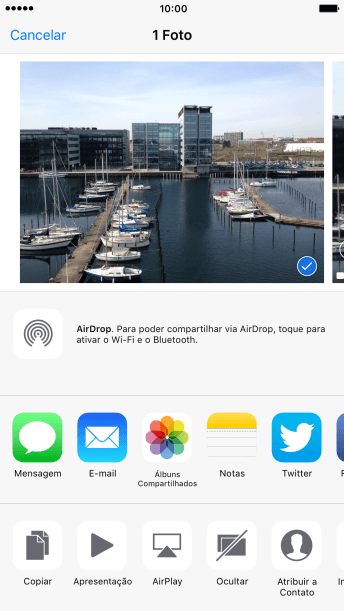 Pressione o ícone de AirDrop para ativar a função. Pressione o ícone de AirDrop para ativar a função.