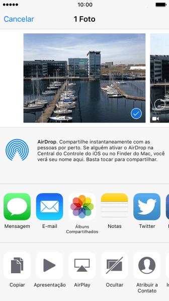 Pressione o ícone de AirDrop para ativar a função. Pressione o ícone de AirDrop para ativar a função.