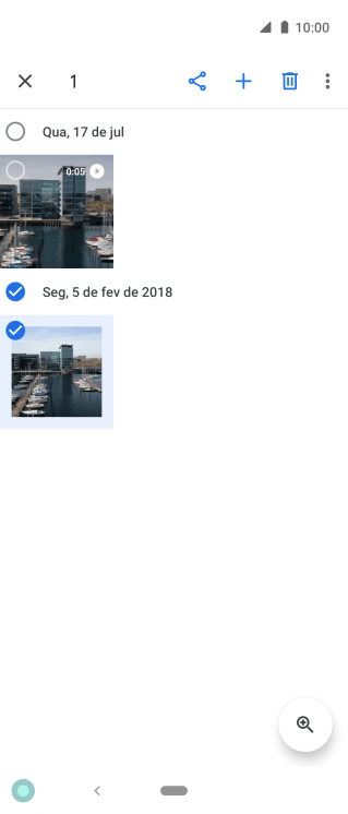Pressione as fotos ou os vídeos desejados. Pressione as fotos ou os vídeos desejados.