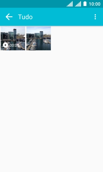Pressione a foto ou o vídeo desejado, e continue pressionando por um instante. Pressione a foto ou o vídeo desejado, e continue pressionando por um instante.