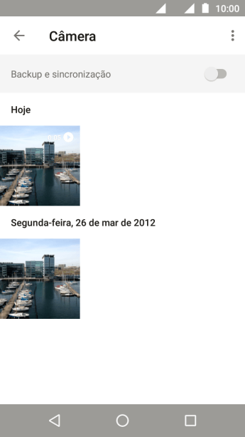 Pressione a foto ou o vídeo desejado, e continue pressionando por um instante. Pressione a foto ou o vídeo desejado, e continue pressionando por um instante.