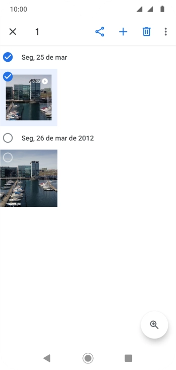 Pressione o campo acima das fotos ou dos vídeos desejados. Pressione o campo acima das fotos ou dos vídeos desejados.
