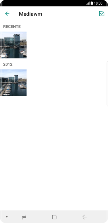 Pressione a foto ou o vídeo desejado. Pressione a foto ou o vídeo desejado.
