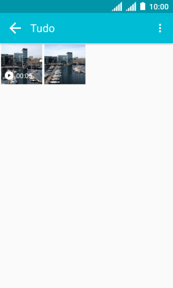 Pressione a foto ou o vídeo desejado, e continue pressionando por um instante. Pressione a foto ou o vídeo desejado, e continue pressionando por um instante.