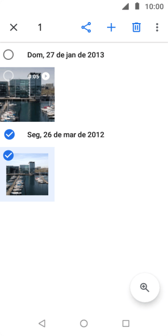 Pressione o campo acima das fotos ou dos vídeos desejados. Pressione o campo acima das fotos ou dos vídeos desejados.