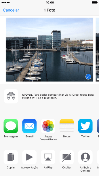 Pressione o ícone de AirDrop para ativar a função. Pressione o ícone de AirDrop para ativar a função.