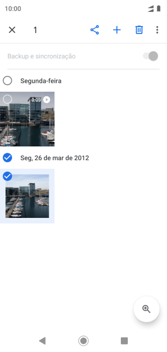 Pressione o campo acima das fotos ou dos vídeos desejados. Pressione o campo acima das fotos ou dos vídeos desejados.