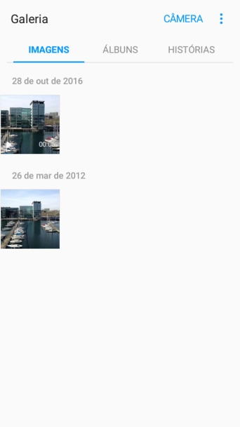 Pressione a foto ou o vídeo desejado, e continue pressionando por um instante. Pressione a foto ou o vídeo desejado, e continue pressionando por um instante.