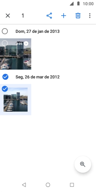 Pressione o campo acima das fotos ou dos vídeos desejados. Pressione o campo acima das fotos ou dos vídeos desejados.