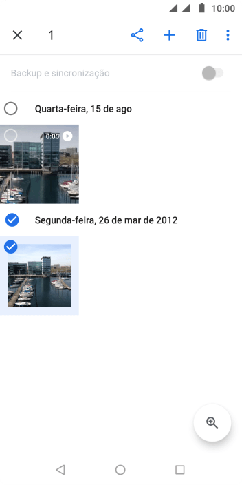 Pressione o campo acima das fotos ou dos vídeos desejados. Pressione o campo acima das fotos ou dos vídeos desejados.