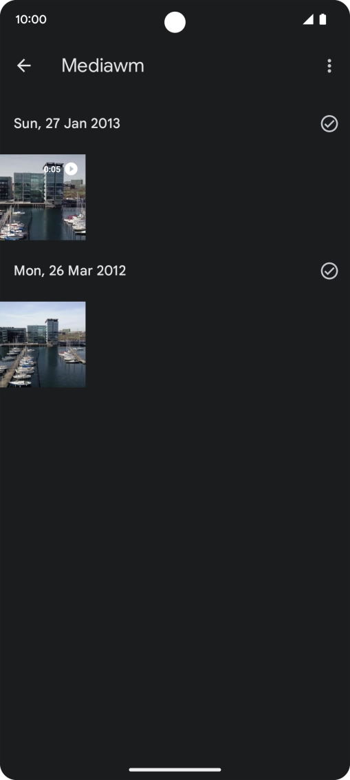 Press and hold the required picture or video clip. Press and hold the required picture or video clip.