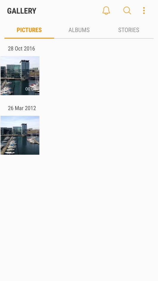Press and hold the required picture or video clip. Press and hold the required picture or video clip.