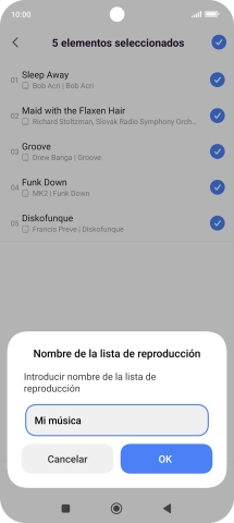 Introduce el nombre deseado de la lista de reproducción y pulsa OK. Introduce el nombre deseado de la lista de reproducción y pulsa OK.