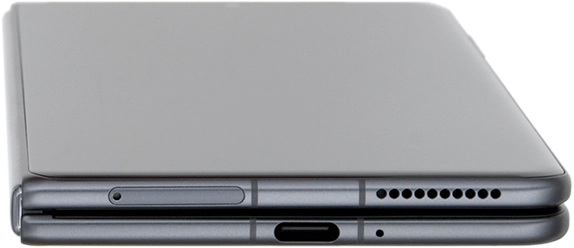 Find the opener for the SIM holder. Insert the opener into the small hole in the SIM holder.