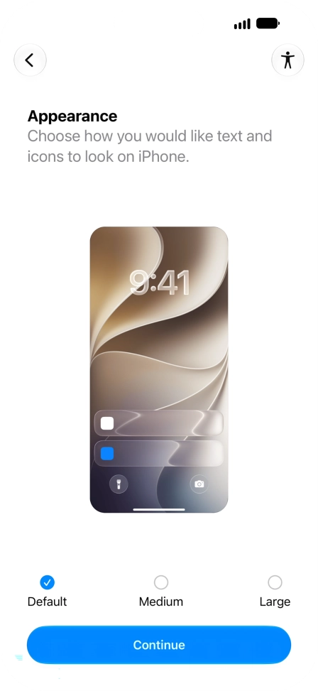 Select the required text and icon size on your phone and press Continue.