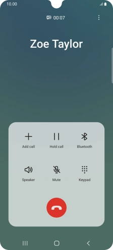 Press the end call icon.