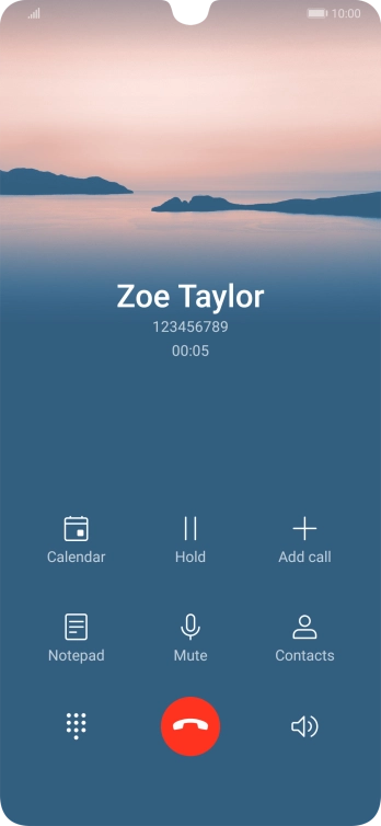 Press the end call icon.