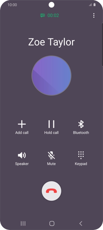 Press the end call icon.