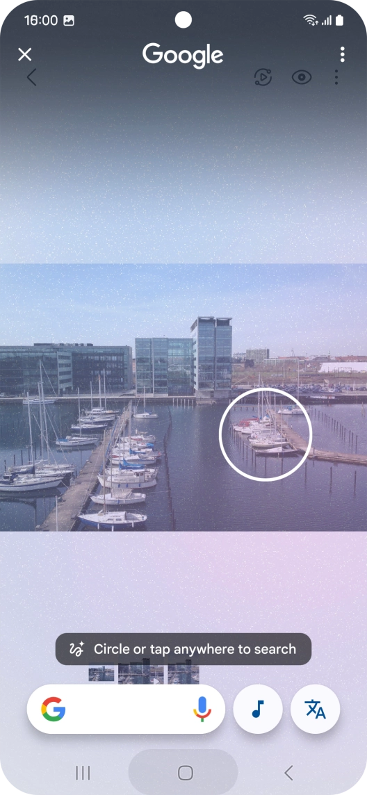 Draw a circle around the required object on the picture and wait for the search results.