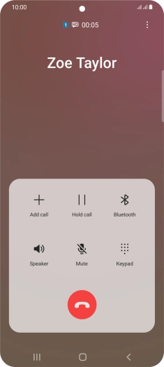 Press the end call icon.