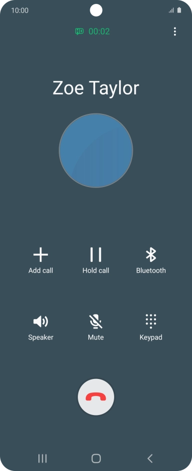 Press the end call icon.