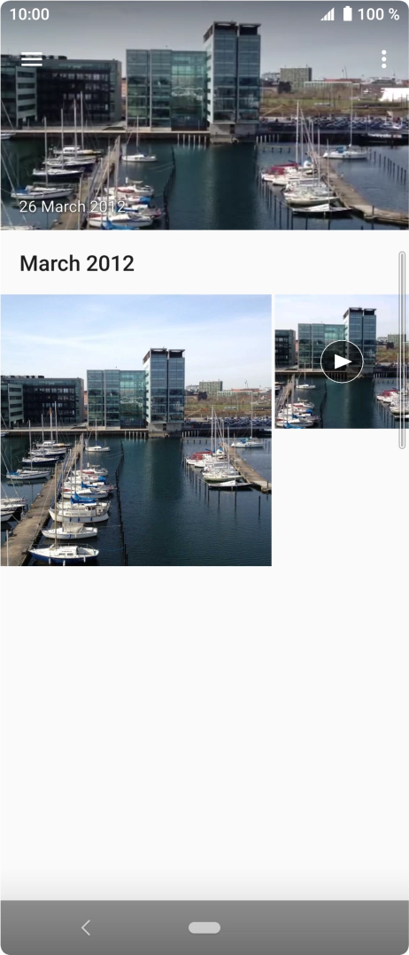 Slide your finger right starting from the left side of the screen.