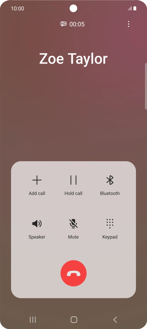Press the end call icon.