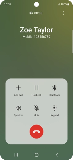 Press the end call icon.