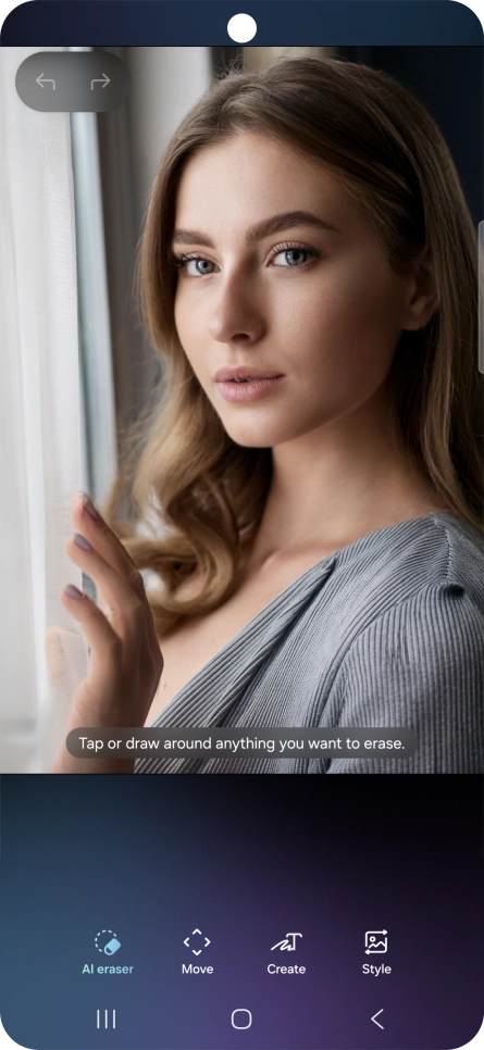 To remove objects from your picture, press AI eraser and follow the instructions on the screen to use the function.