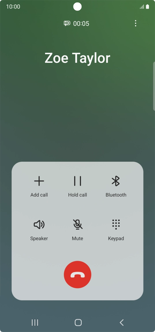 Press the end call icon.