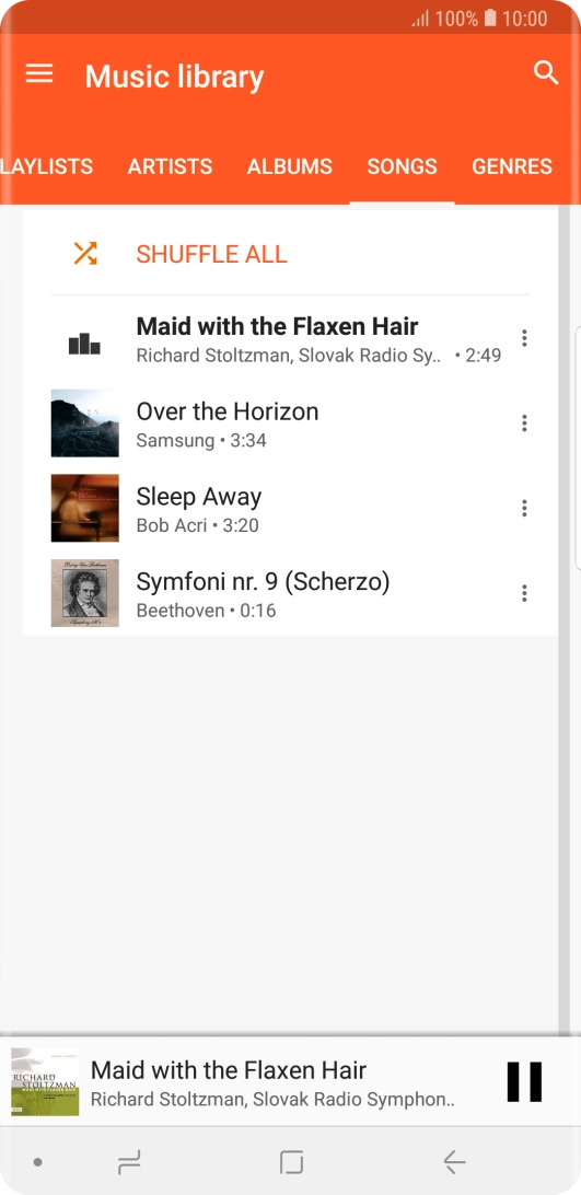 Press the song title at the bottom of the screen.