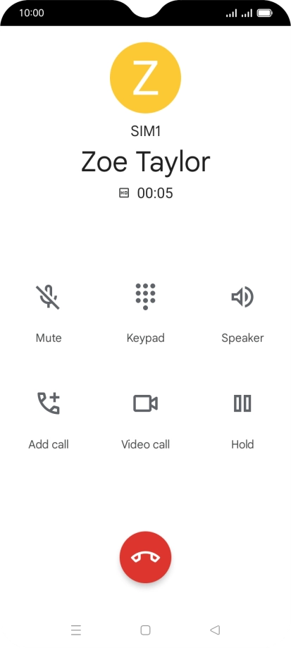 Press the end call icon.