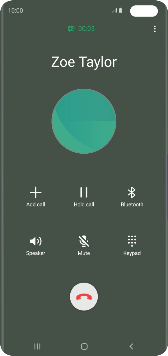 Press the end call icon.