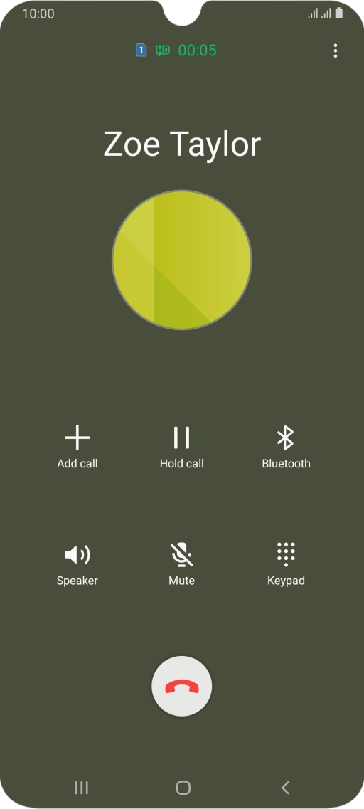 Press the end call icon.