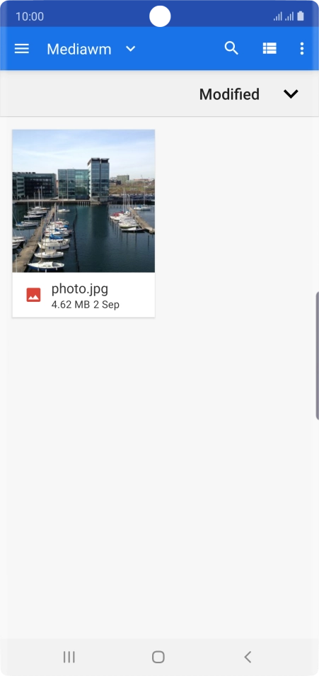 Slide your finger right starting from the left side of the screen.