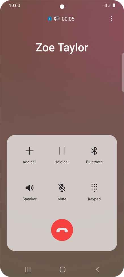 Press the end call icon.