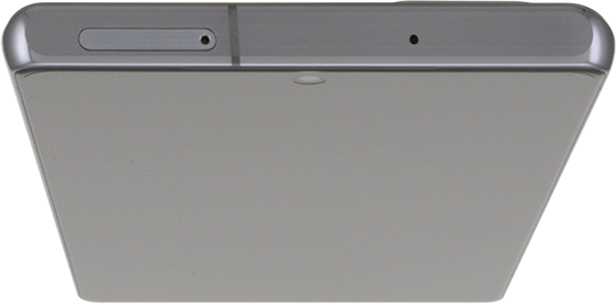 Insert the opener into the small hole in the SIM holder.