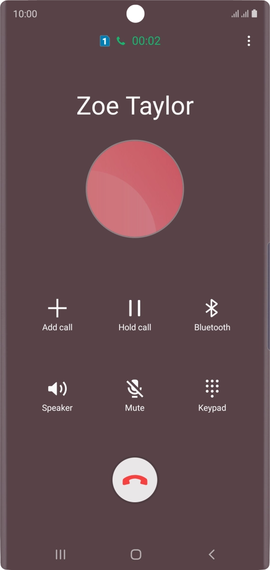 Press the end call icon.