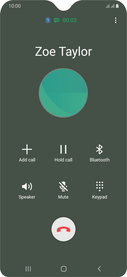 Press the end call icon.