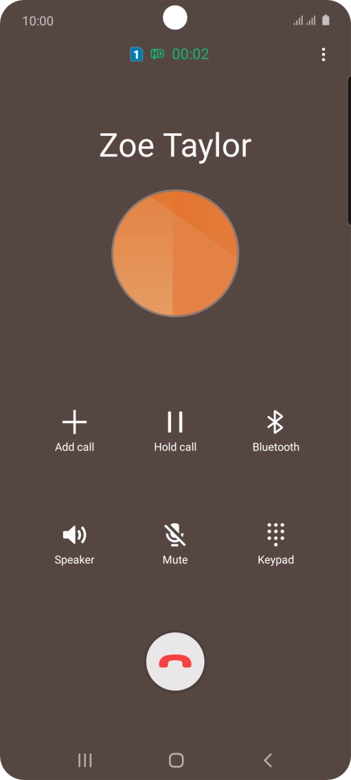 Press the end call icon.