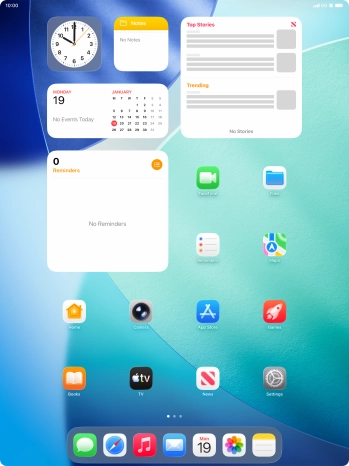 The alarm icon shows that the alarm is set.