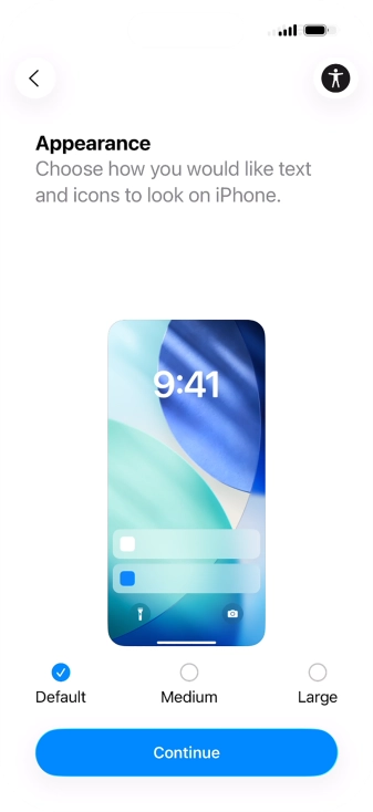 Select the required text and icon size on your phone and press Continue.