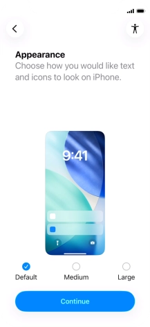 Select the required text and icon size on your phone and press Continue.