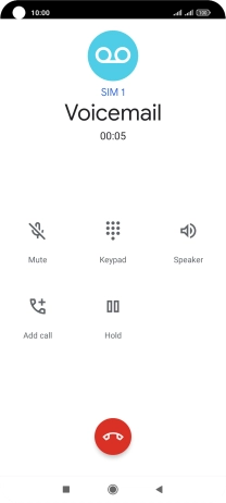Press the end call icon.