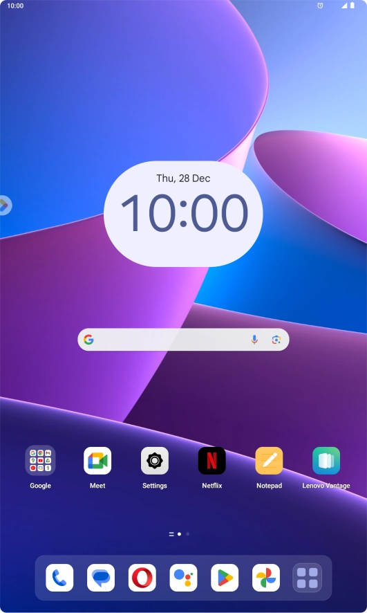 The alarm icon shows that the alarm is set.