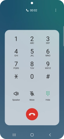 Press the end call icon.
