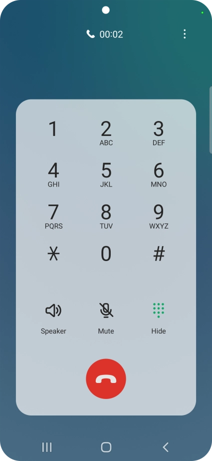 Press the end call icon.