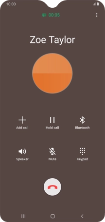 Press the end call icon.