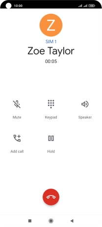 Press the end call icon.