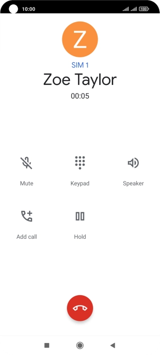 Press the end call icon.